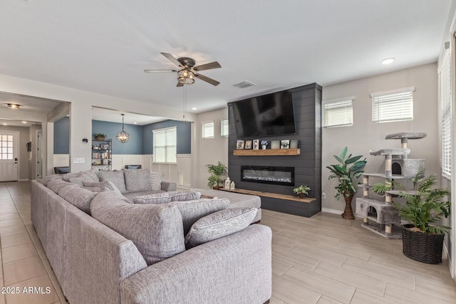 4514 W Hazel Ln, San Tan Valley, AZ 85144 - living room with a ceiling fan, a fireplace, and recessed lighting