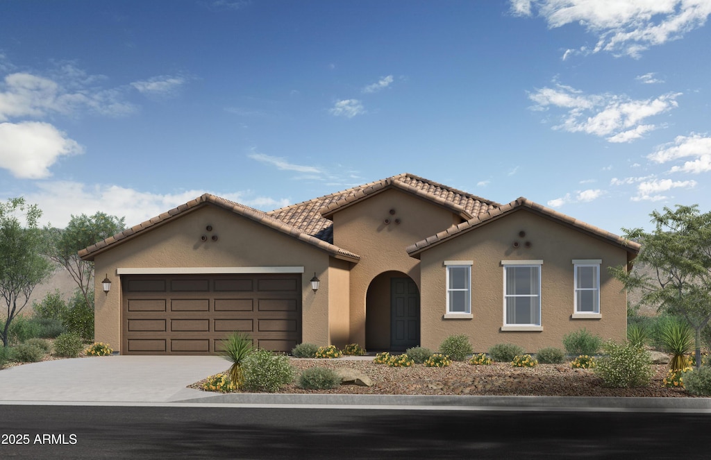 17181 W Oberlin Way, Surprise, AZ 85387 - mediterranean / spanish home featuring concrete driveway, a garage, stucco siding, and a tile roof