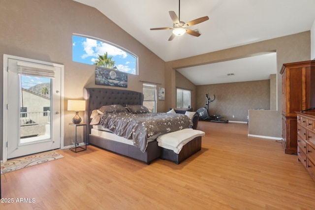 bedroom featuring ceiling fan, light wood-type flooring, multiple windows, and access to outside