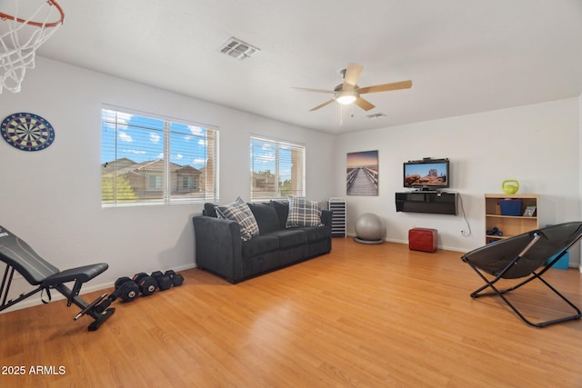 living room with hardwood / wood-style flooring and ceiling fan