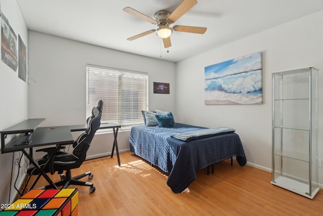 bedroom featuring wood-type flooring and ceiling fan