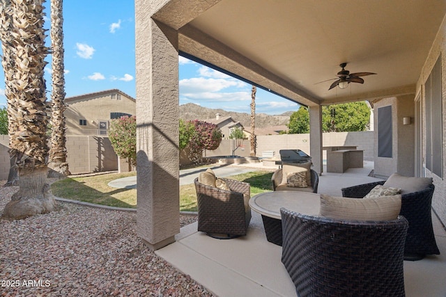 view of patio featuring ceiling fan