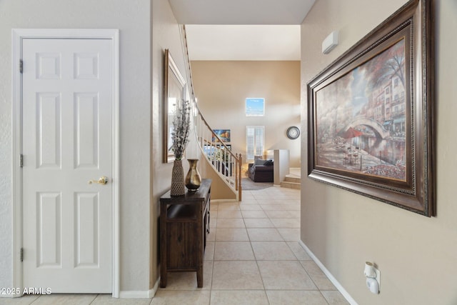 hall with light tile patterned floors