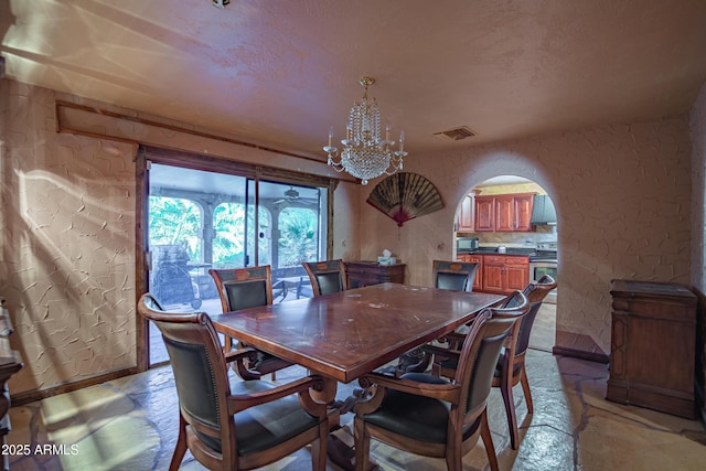 dining area featuring a chandelier