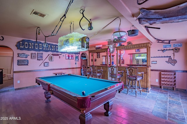 playroom featuring hardwood / wood-style flooring, billiards, bar, and track lighting