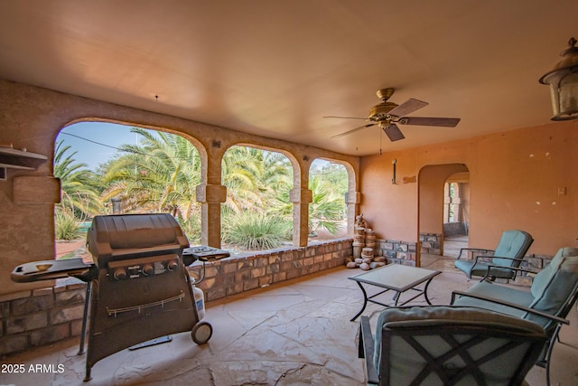 view of patio / terrace with a grill and ceiling fan