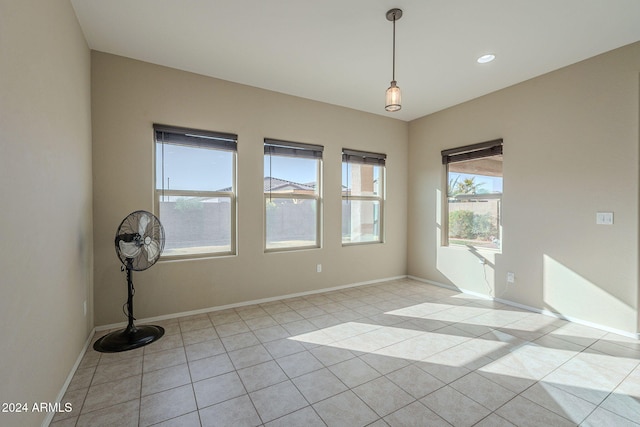 unfurnished room with light tile patterned flooring