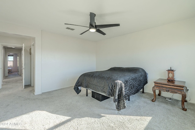 bedroom featuring ceiling fan and light colored carpet