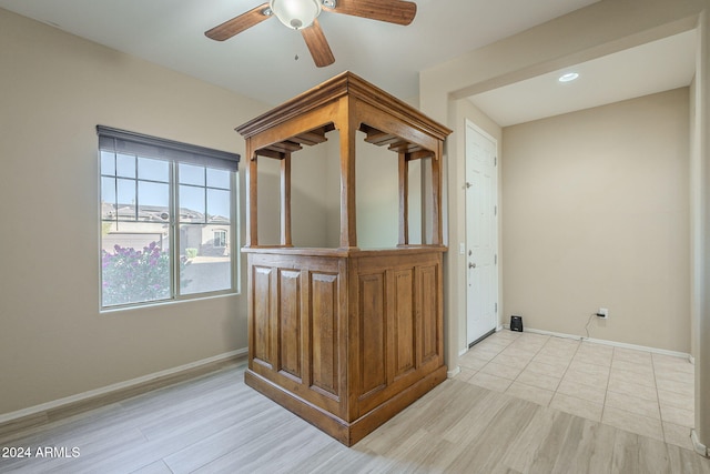 unfurnished room with light wood-type flooring and ceiling fan