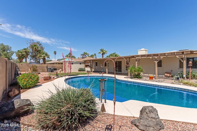 view of pool featuring a fenced backyard, a fenced in pool, and a patio