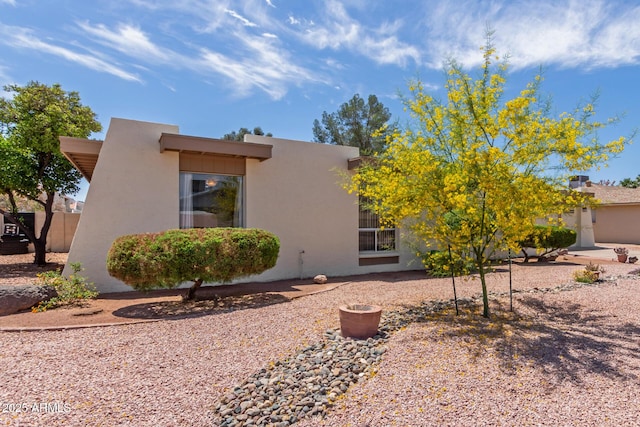 exterior space with stucco siding