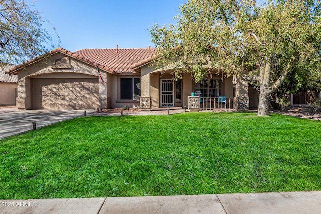 view of front of home with a garage and a front lawn