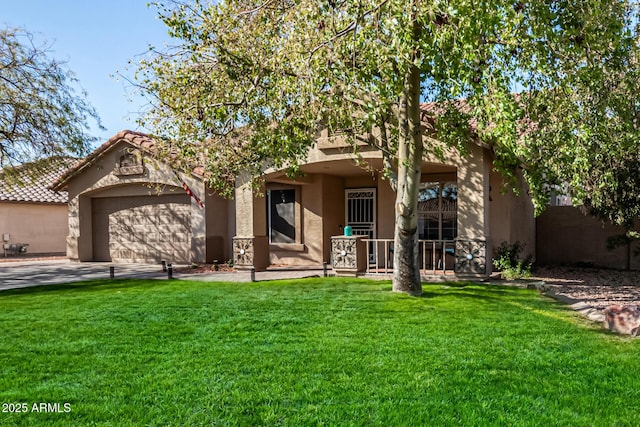 view of front of home with a garage and a front lawn