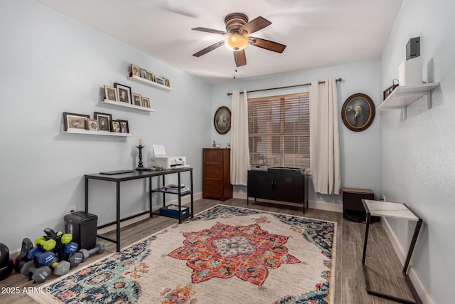 interior space featuring ceiling fan and wood-type flooring