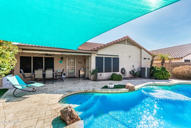 view of pool featuring ceiling fan, a patio area, and cooling unit