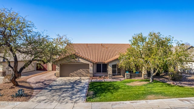 view of front of house with a front lawn and a garage