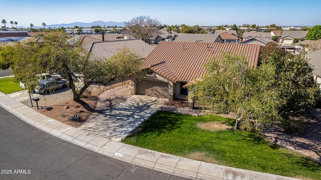 birds eye view of property with a mountain view