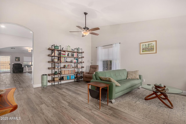 living room with ceiling fan and wood-type flooring