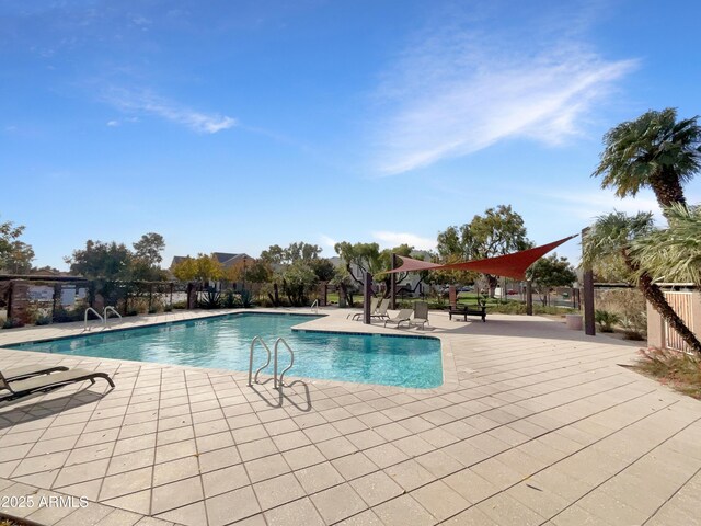 view of swimming pool featuring a patio