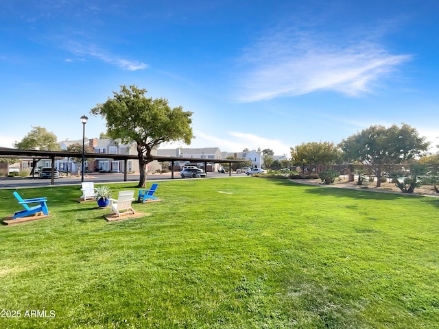 view of property's community featuring a lawn