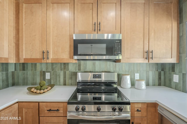 kitchen featuring tasteful backsplash and appliances with stainless steel finishes