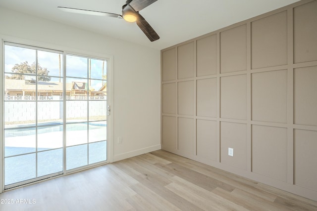 unfurnished room featuring ceiling fan and light wood-type flooring