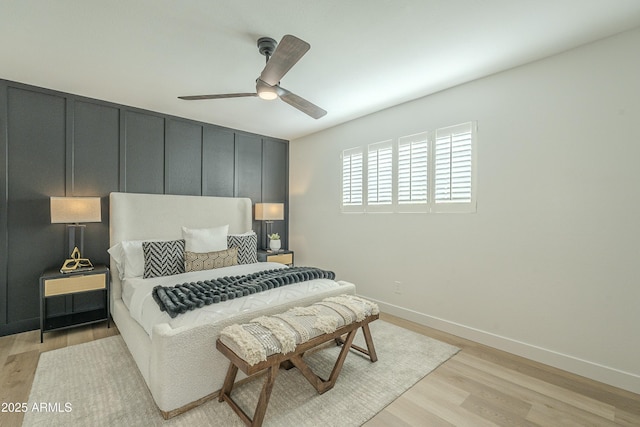 bedroom with ceiling fan and light hardwood / wood-style floors