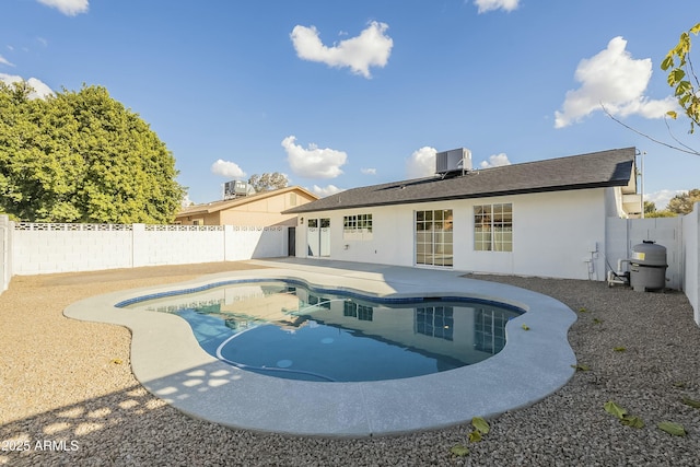 view of pool featuring central AC unit and a patio area