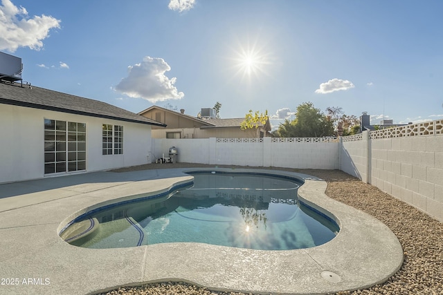 view of swimming pool with central AC unit and a patio area