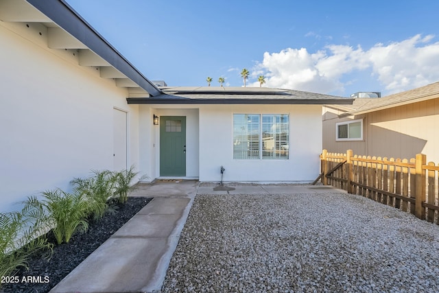 doorway to property with solar panels