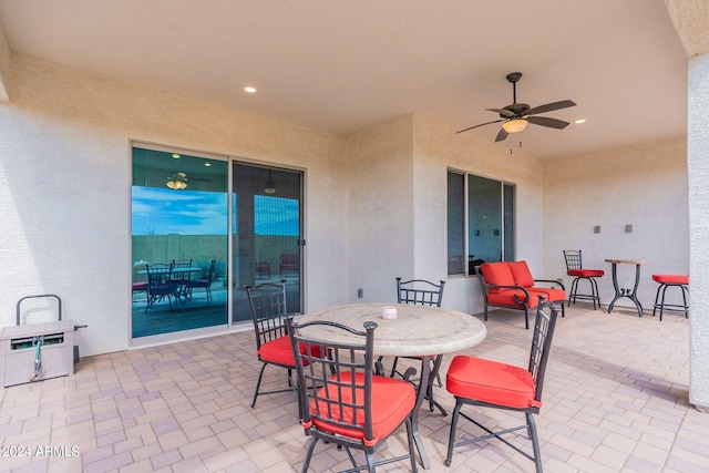 view of patio featuring ceiling fan