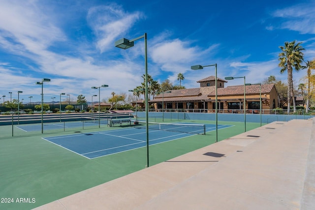 view of sport court featuring fence