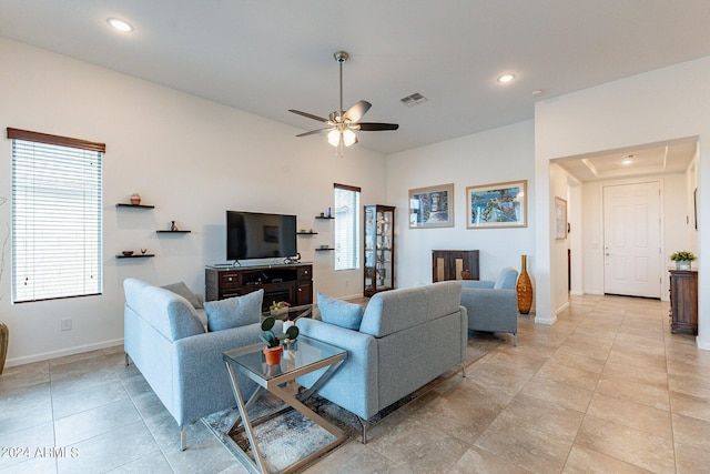 living area with visible vents, recessed lighting, and baseboards