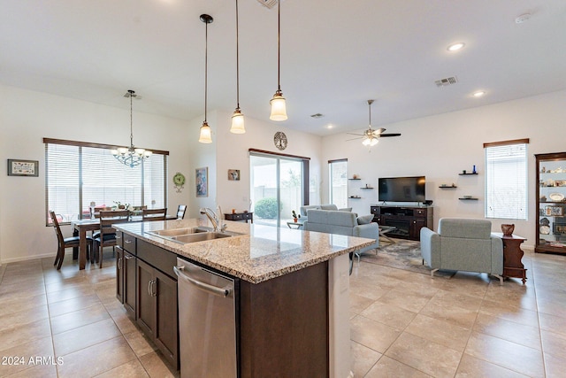 kitchen with a wealth of natural light, dishwasher, sink, and ceiling fan with notable chandelier