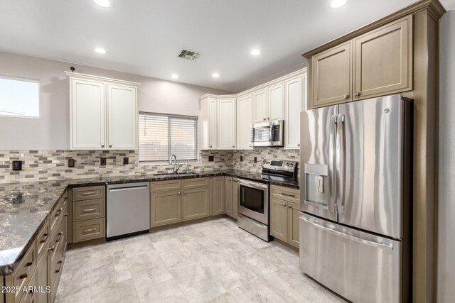 1918 E Megan St, Gilbert, AZ 85295 - kitchen with appliances with stainless steel finishes, tasteful backsplash, dark stone countertops, and recessed lighting