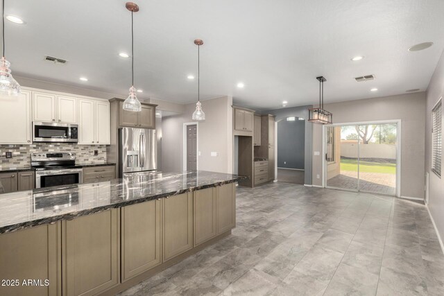 1918 E Megan St, Gilbert, AZ 85295 - kitchen featuring stainless steel appliances, decorative backsplash, dark stone countertops, recessed lighting, and pendant lighting