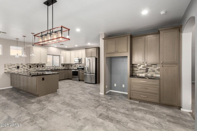 1918 E Megan St, Gilbert, AZ 85295 - kitchen with stainless steel appliances, a peninsula, backsplash, pendant lighting, and recessed lighting