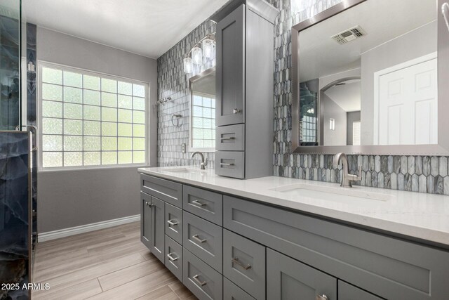 1918 E Megan St, Gilbert, AZ 85295 - full bathroom featuring double vanity, backsplash, and wood finished floors