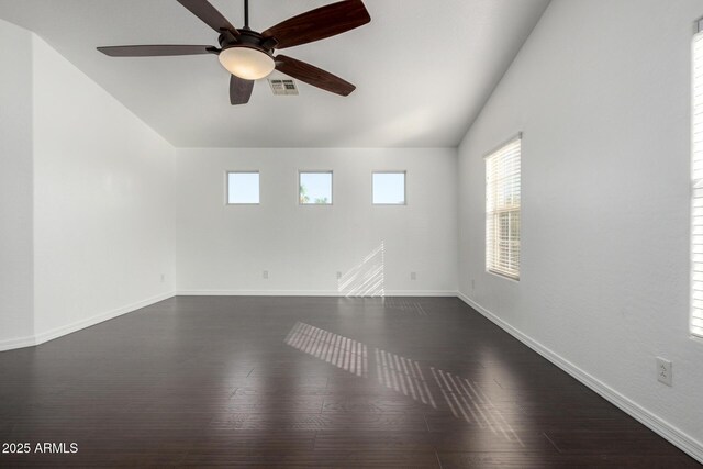 1918 E Megan St, Gilbert, AZ 85295 - unfurnished room with dark wood finished floors, healthy amount of natural light, lofted ceiling, and ceiling fan