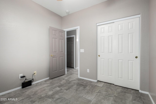 1918 E Megan St, Gilbert, AZ 85295 - unfurnished bedroom featuring a closet and baseboards