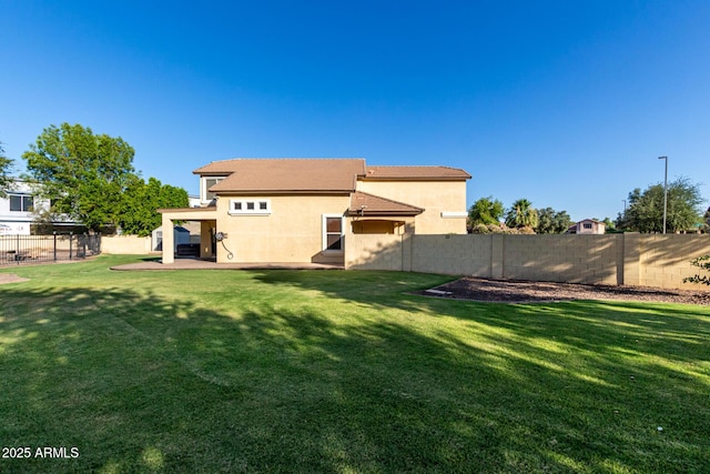 1918 E Megan St, Gilbert, AZ 85295 - rear view of property featuring a fenced backyard, stucco siding, and a patio area