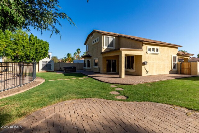 1918 E Megan St, Gilbert, AZ 85295 - rear view of house with a shed, a fenced backyard, a patio area, and stucco siding
