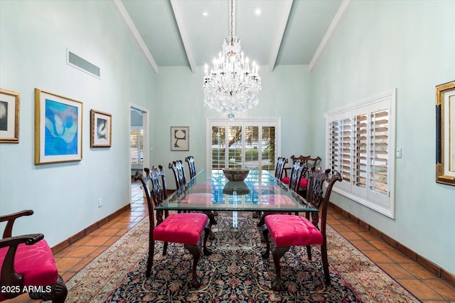 84 Biltmore Est, Phoenix, AZ 85016 - dining space featuring a high ceiling, a notable chandelier, baseboards, and a healthy amount of sunlight
