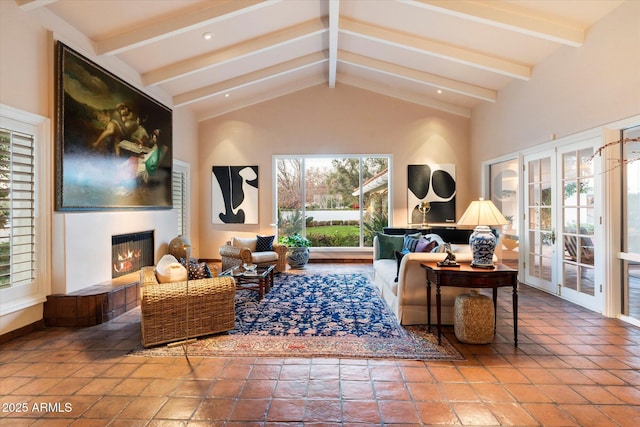 84 Biltmore Est, Phoenix, AZ 85016 - interior space featuring a glass covered fireplace, plenty of natural light, and lofted ceiling with beams