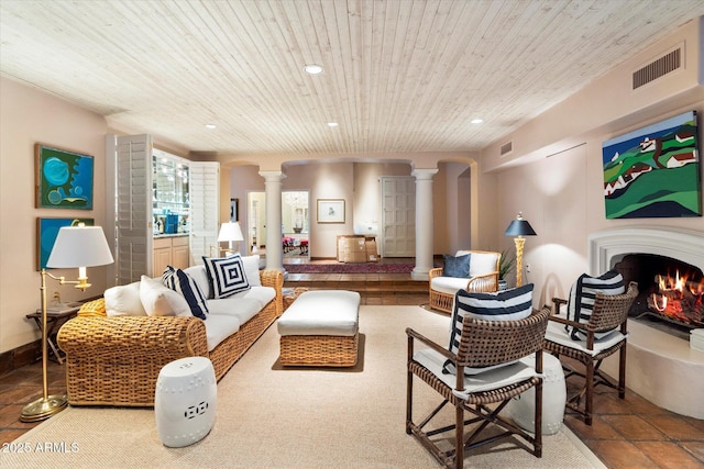 84 Biltmore Est, Phoenix, AZ 85016 - living area featuring ornate columns, a warm lit fireplace, visible vents, and recessed lighting