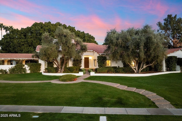 84 Biltmore Est, Phoenix, AZ 85016 - mediterranean / spanish-style home with a yard, a tile roof, and stucco siding