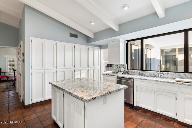 84 Biltmore Est, Phoenix, AZ 85016 - kitchen featuring stainless steel dishwasher, white cabinets, visible vents, a kitchen island, and a sink