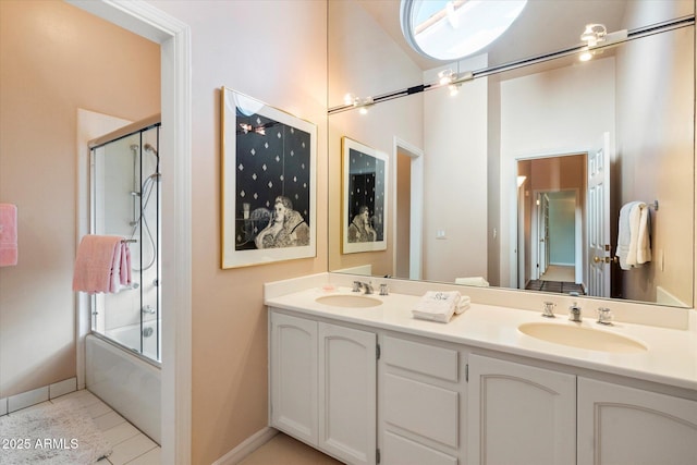 84 Biltmore Est, Phoenix, AZ 85016 - bathroom with shower / bath combination with glass door, double vanity, baseboards, and a sink