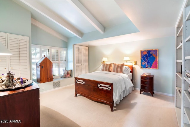84 Biltmore Est, Phoenix, AZ 85016 - bedroom with carpet floors, baseboards, vaulted ceiling with beams, and visible vents