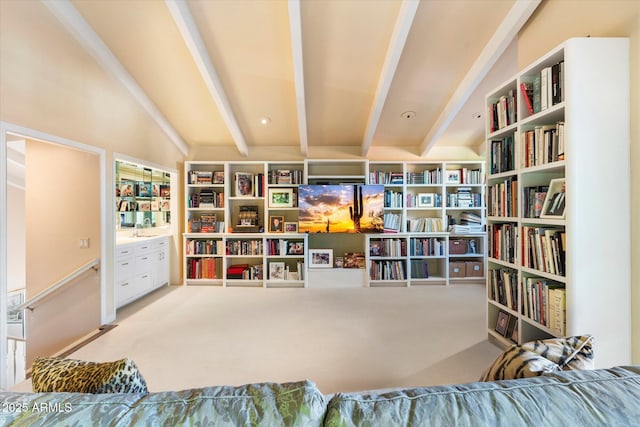 84 Biltmore Est, Phoenix, AZ 85016 - living area featuring beamed ceiling, wall of books, and carpet floors